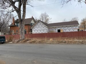 Denver home addition exterior with sheathing in progress