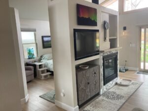 Finished garage conversion living room with fireplace